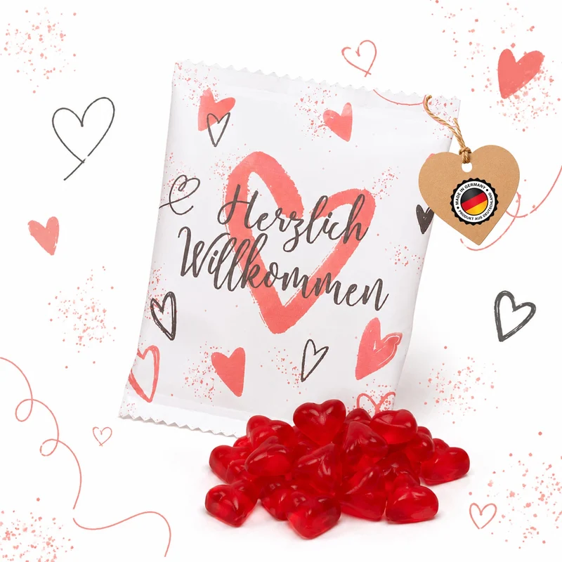 Fruchtgummi Päckchen Herzlich willkommen weiß rot – Gastgeschenk mit Herzen